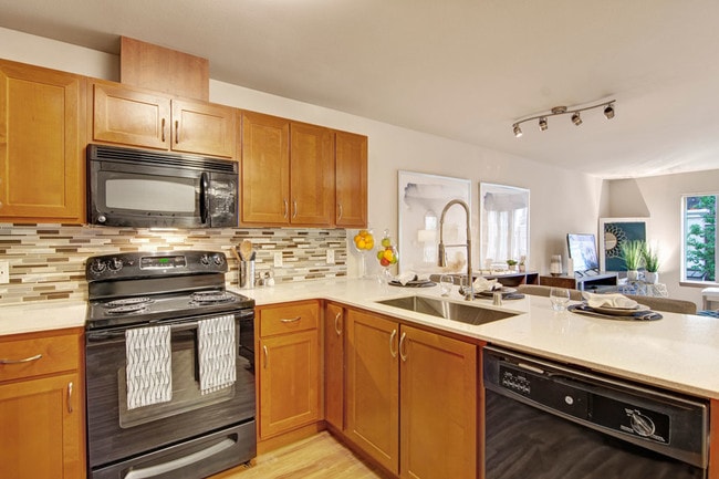 Echo Lake Kitchen with Black Appliances - Echo Lake Apartment Homes