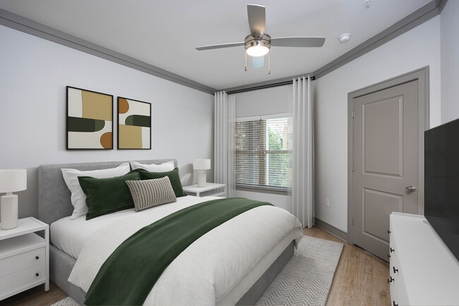 Bedroom with hard-surface vinyl plank flooring and ceiling fan - Avalon Perimeter Park