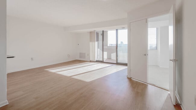 Living Room with Balcony and Hard Surface Flooring - Courthouse Plaza