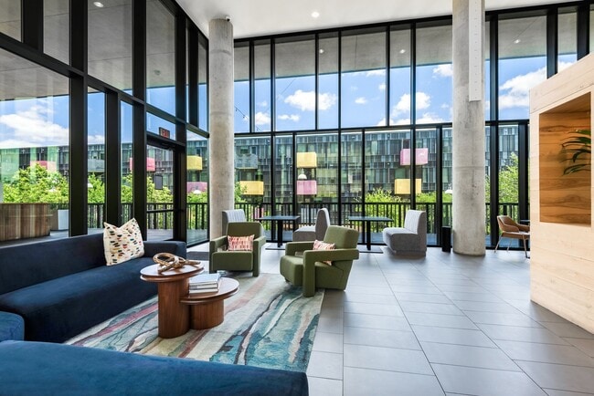 Indoor Lounge Overlooking Courtyard with Sectionals and Chair Seating - Lamar Union