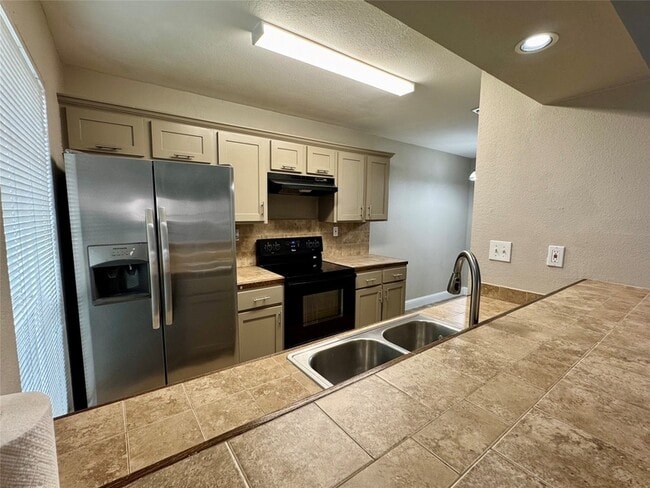 Building Photo - 5981 Arapaho Rd Unit 303