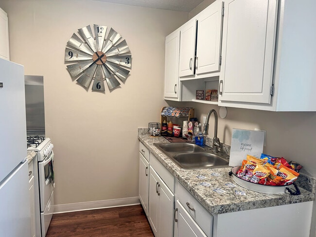 Kitchen with White Cabinets and Appliances - Shores of Roosevelt Park