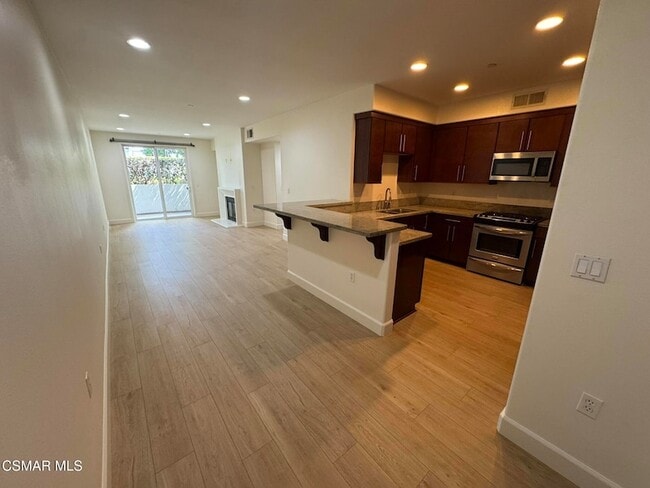 Building Photo - 14412 Killion St Unit 102