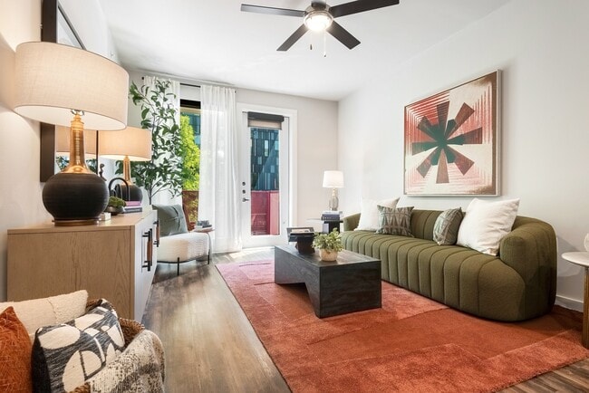 Living Room with Balcony Access and Modern Furnishings - Lamar Union