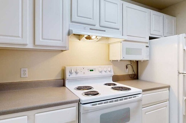 Generous kitchen cabinet storage means your favorite ingredients, gadgets, and cookware are always within reach no clutter, just comfort. - Northbrook Apartments