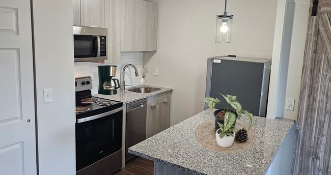 Sleek Kitchens with Dishwasher - Center Square Apartments