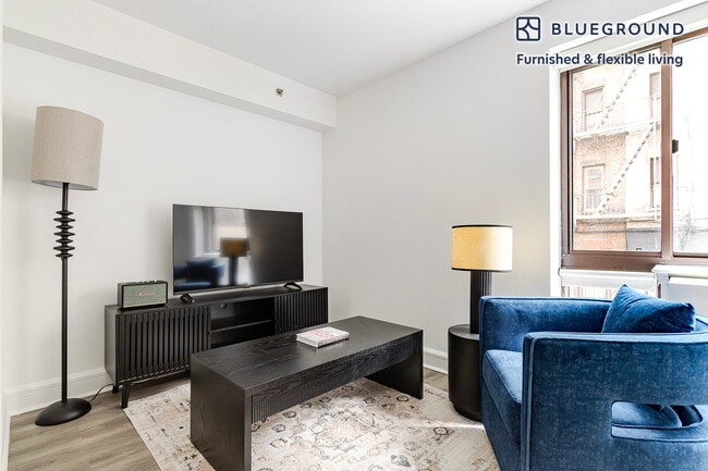 Building Photo - 311 W 50th St Unit FL2-ID2073