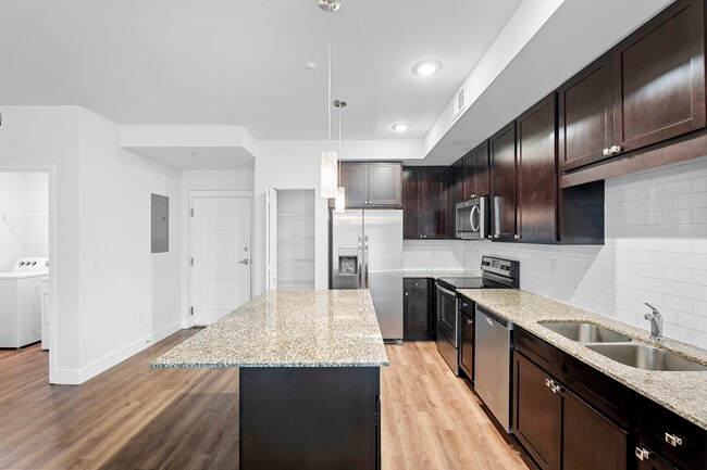 Cook, dine, and gather in a stylish kitchen space. - Milano Lakes