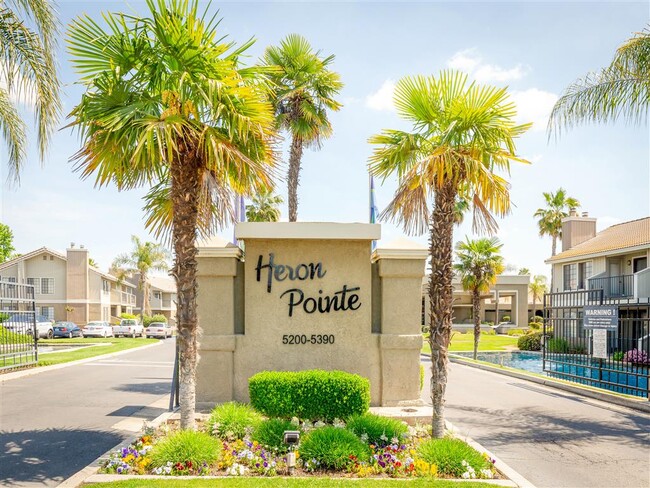 Monument Sign at Heron Pointe - Heron Pointe Apartments & Townhomes